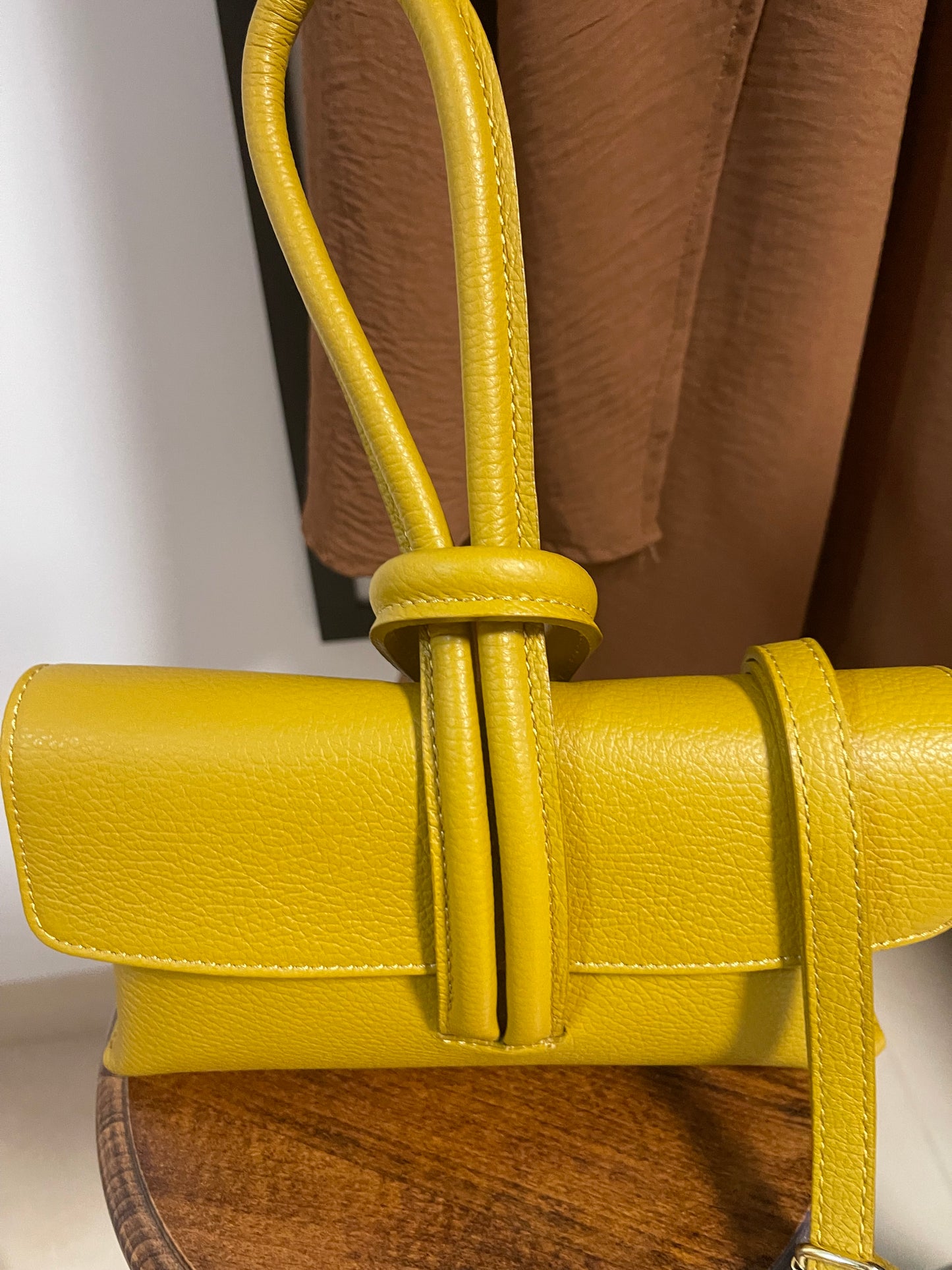 Leather ochre wristlet bag