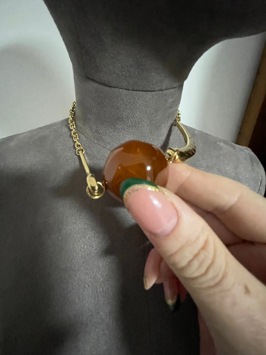 Hammered gold effect neckpiece with large resin bead