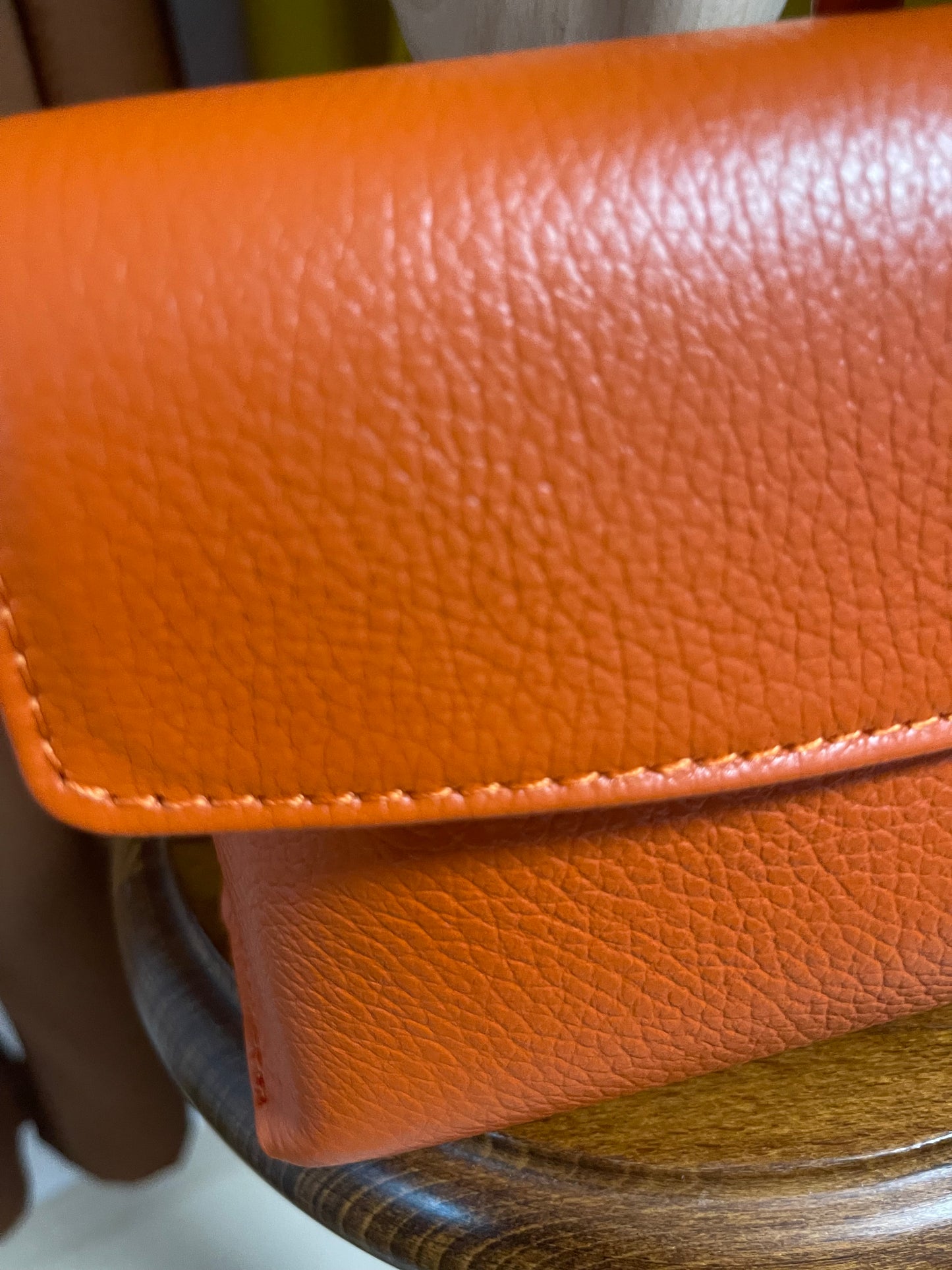 ) Leather orange wristlet bag