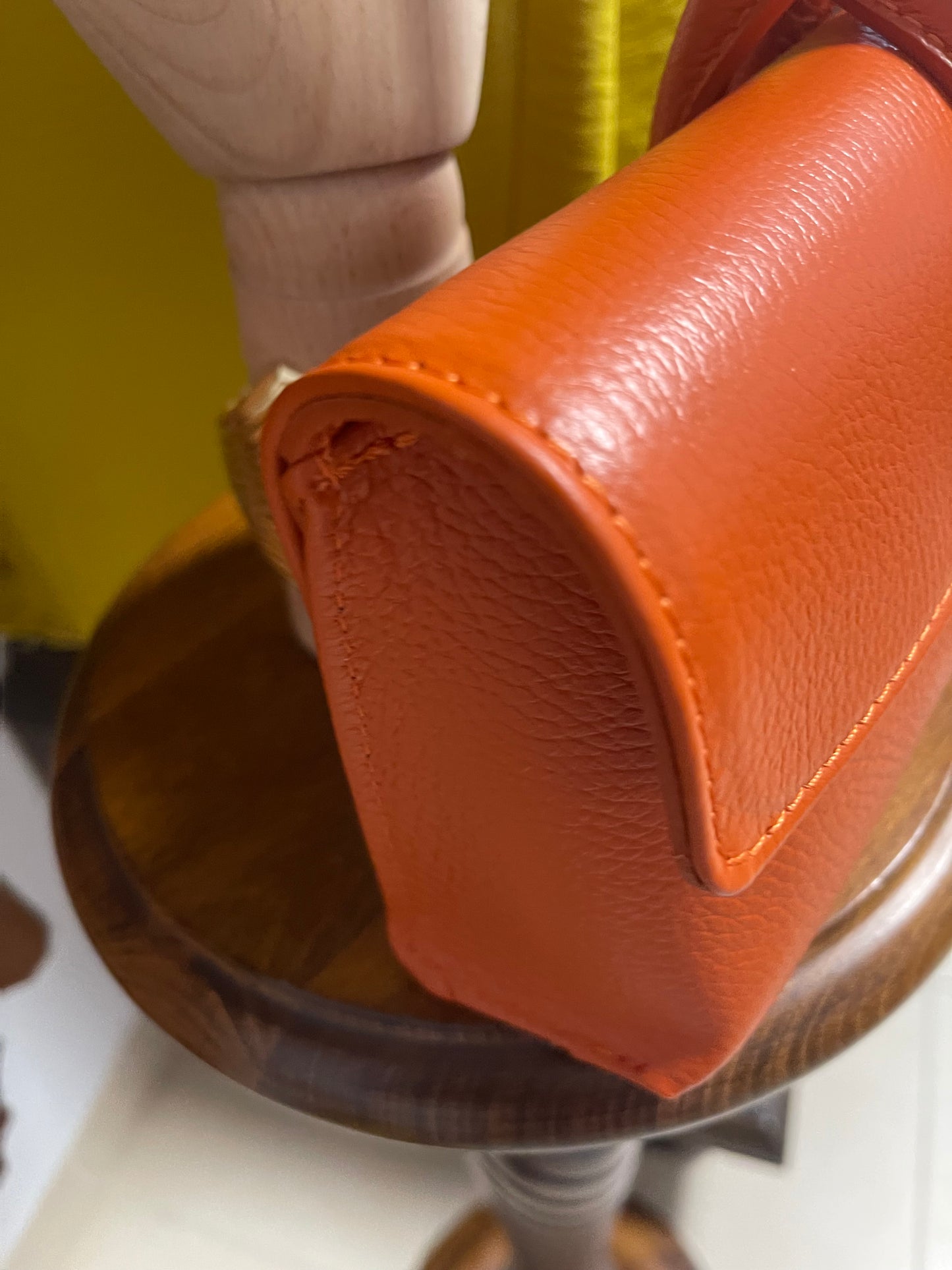 ) Leather orange wristlet bag