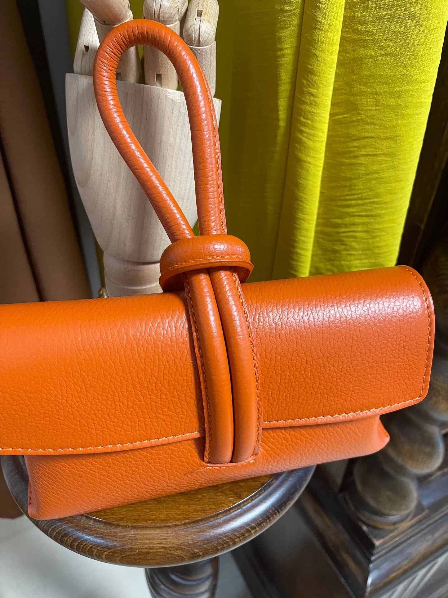 ) Leather orange wristlet bag
