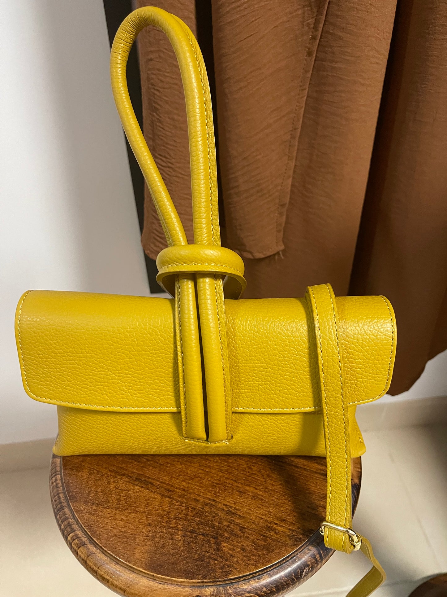 Leather ochre wristlet bag