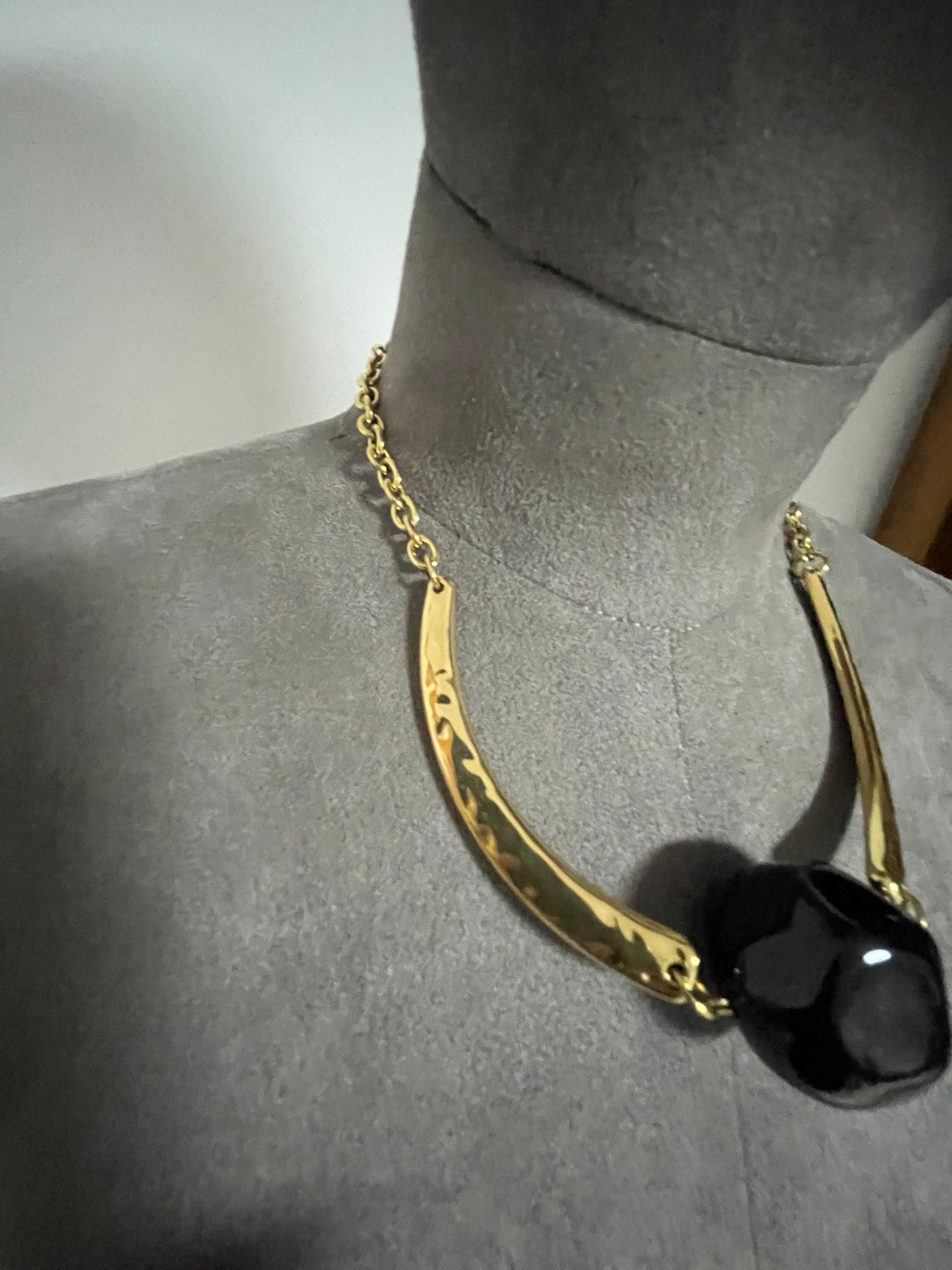 Hammered gold effect neckpiece with large resin bead