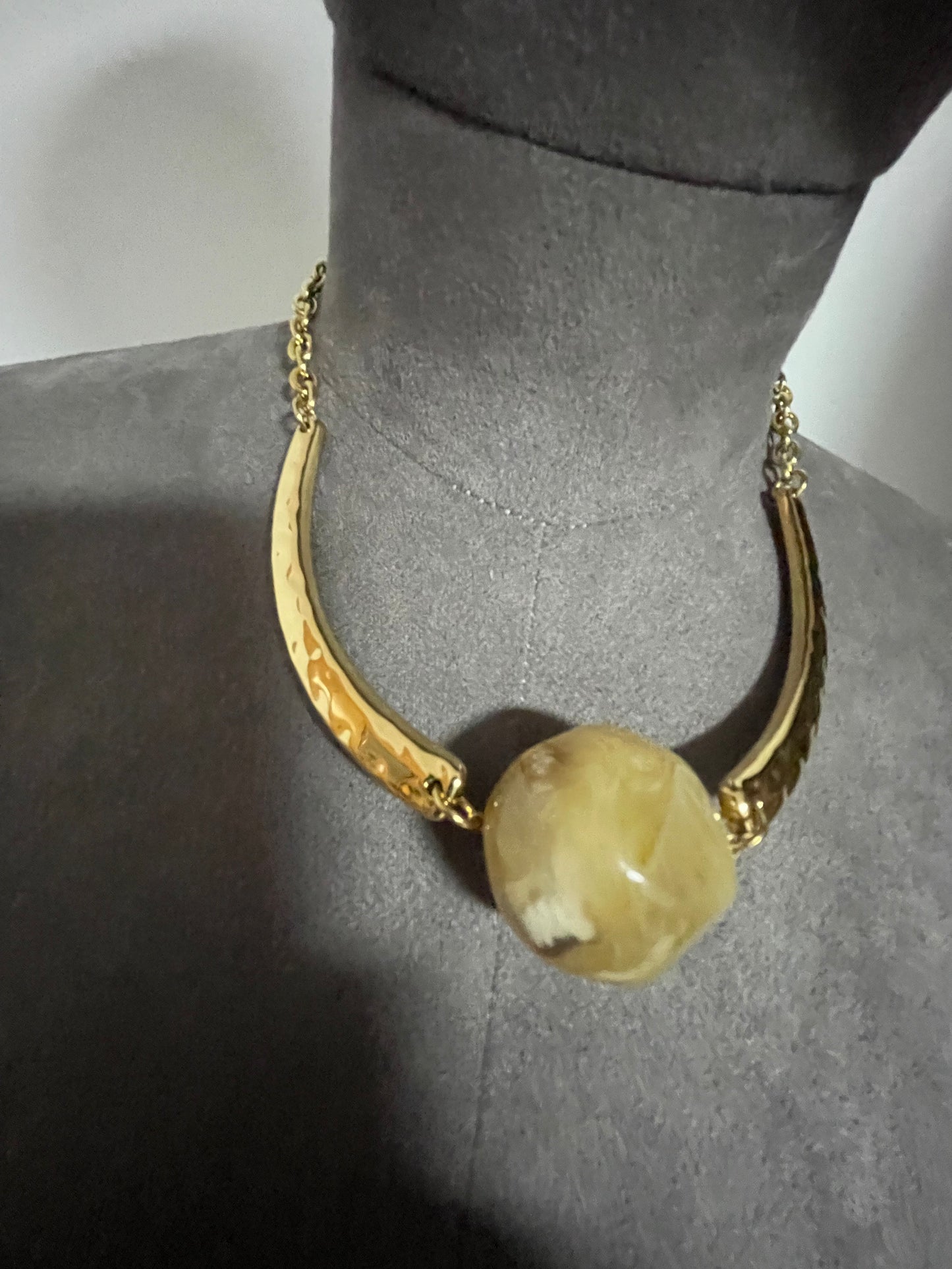 Hammered gold effect neckpiece with large resin bead