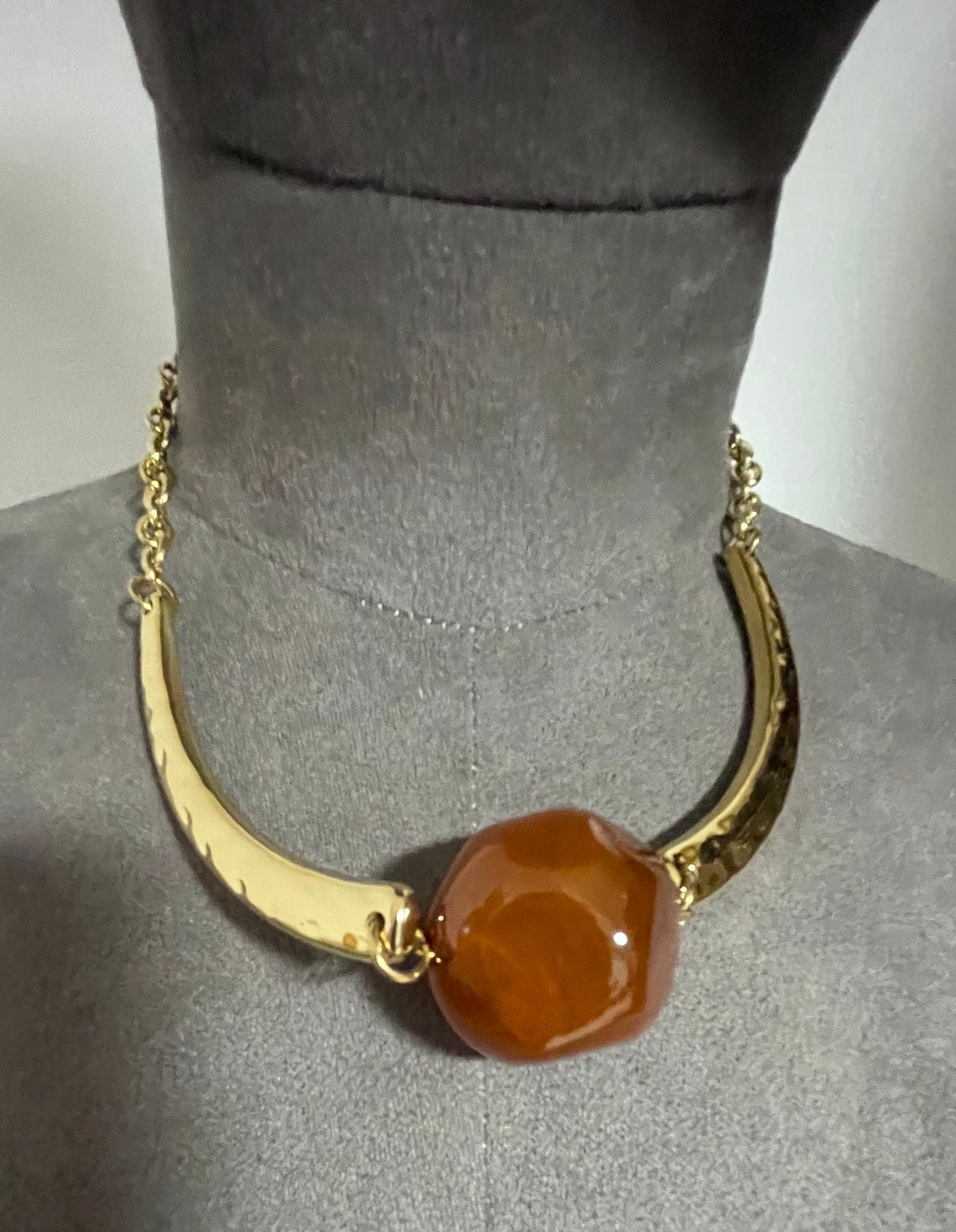 Hammered gold effect neckpiece with large resin bead