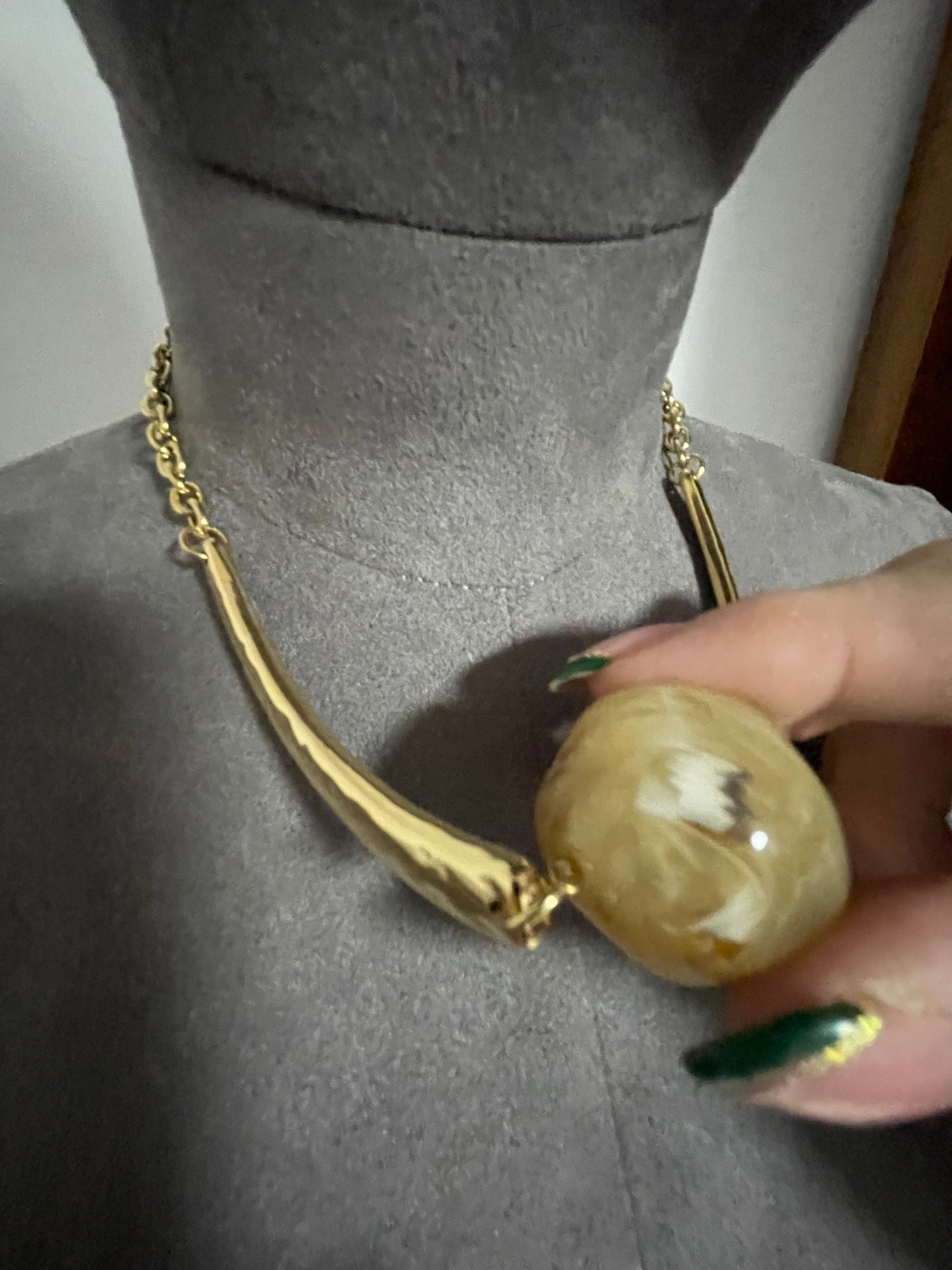 Hammered gold effect neckpiece with large resin bead