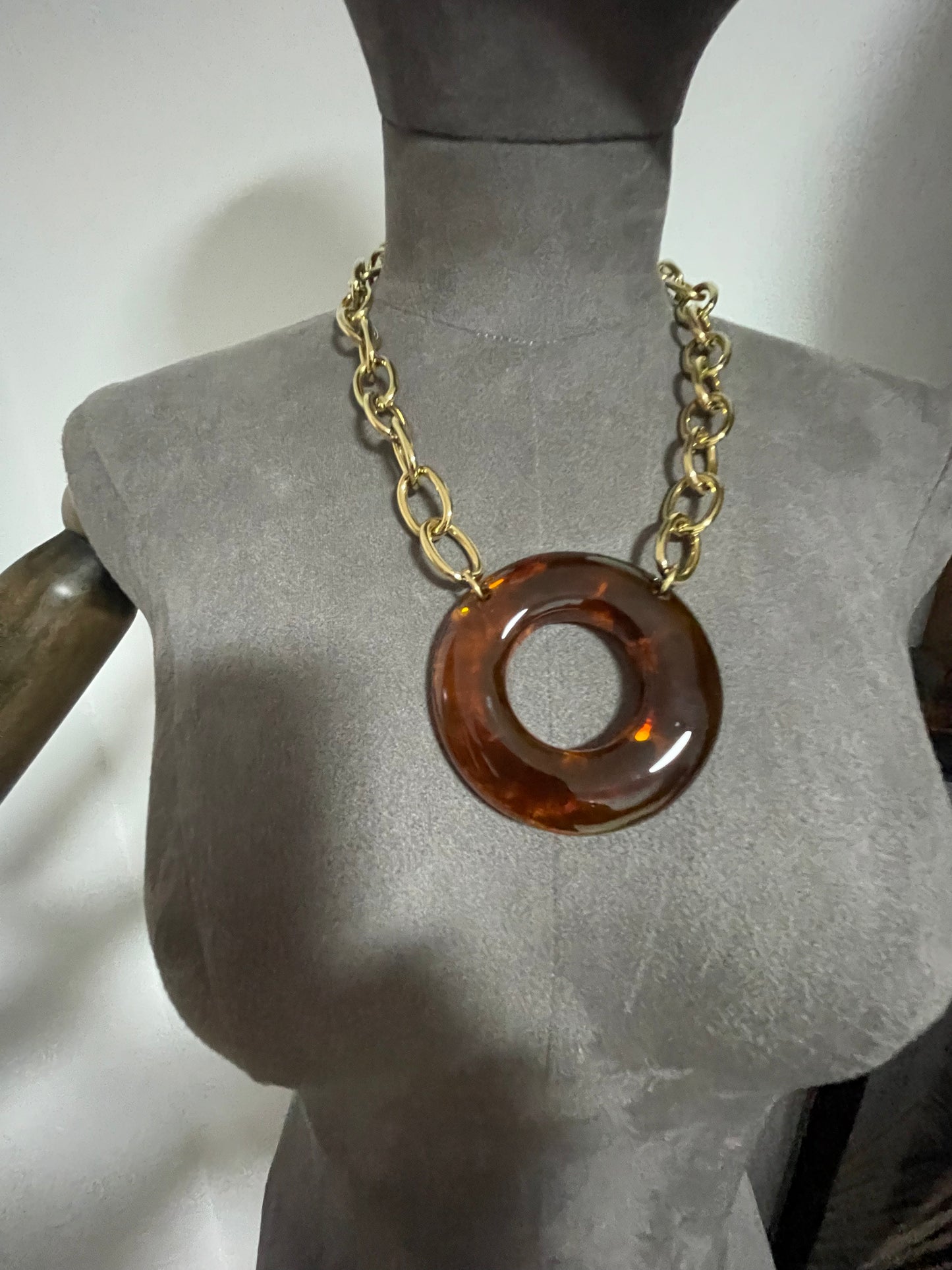Link neckpiece with resin centre