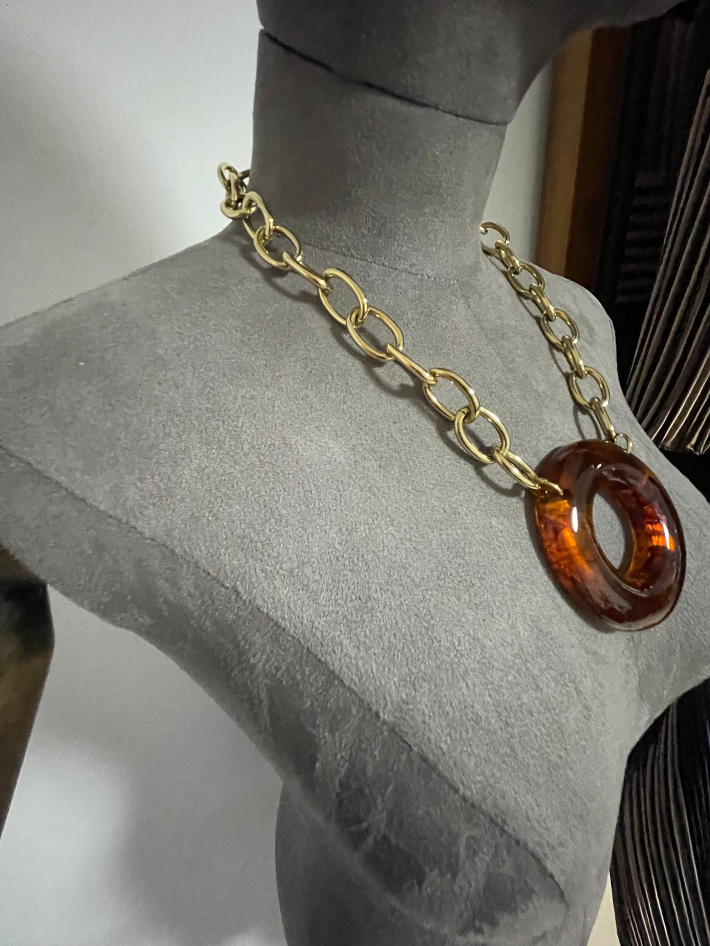 Link neckpiece with resin centre